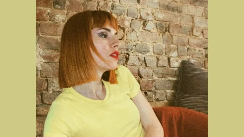 Short Bob Hairstyles With Bangs 2 Copper Chic: The Edgy Blunt Bob with Fringe