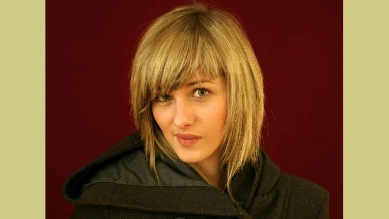 Short Bob Hairstyles With Bangs 8 The Flattering Layered Bob with Side-Swept Bangs